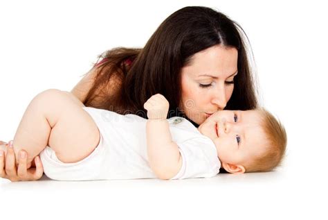 Mom Kissing Baby On The Cheek Stock Image Image 27296471