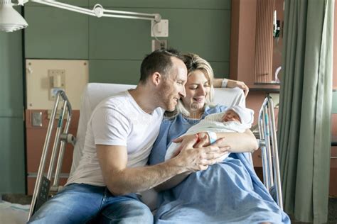 Mother With Her Newborn Baby At The Hospital A Day After A Natural