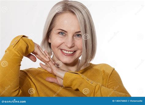 Middle Aged Blonde Emotionally Posing In A Studio Happy Woman In