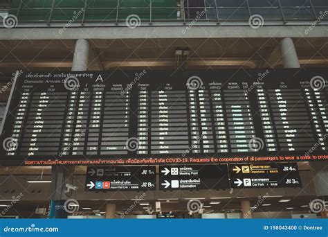 Arrivals Display Board At Airport Terminal Stock Photography