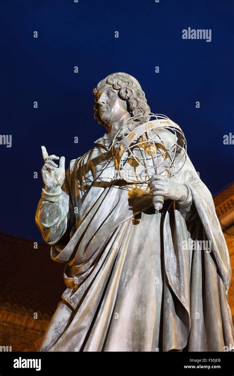 Nicolaus Copernicus monument in Torun, Poland at night, city landmark ...