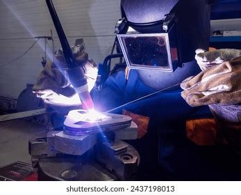 Welder Performing Tungsten Inert Gas Welding Stock Photo