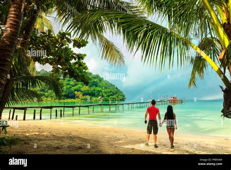 interracial couple enjoy vacation on the tropical beach Stock Photo - Alamy