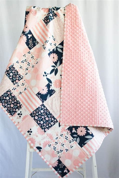 This Handmade Patchwork Baby Quilt Featuring Navy And Pink Floral