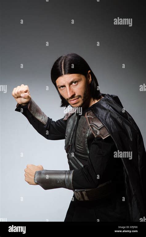 Angry Warrior Against Dark Background Stock Photo Alamy