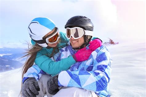 Premium Photo Happy Couple At Snowy Ski Resort Winter Vacation