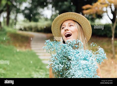 Portrait Of Beautiful Stylish Blonde Millennial Woman Posing Outdoor