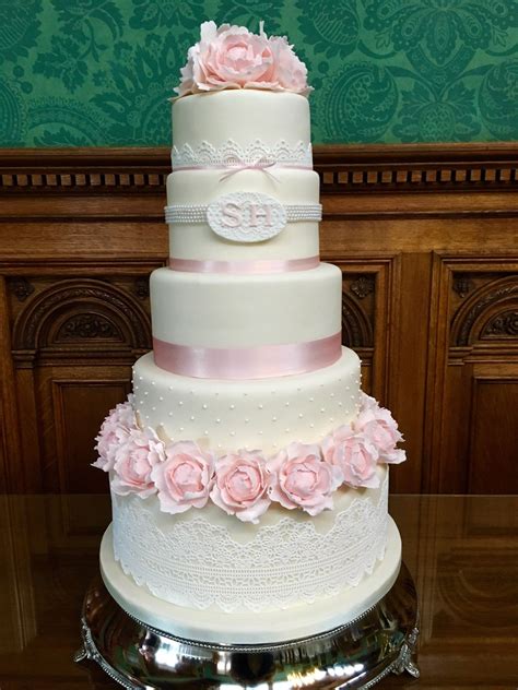 Ivory And Lace 5 Tier Wedding Cake With Pale Pink Peonies And Monogram