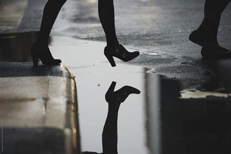 Walking Over A Puddle By Stocksy Contributor Lauren Lee Stocksy