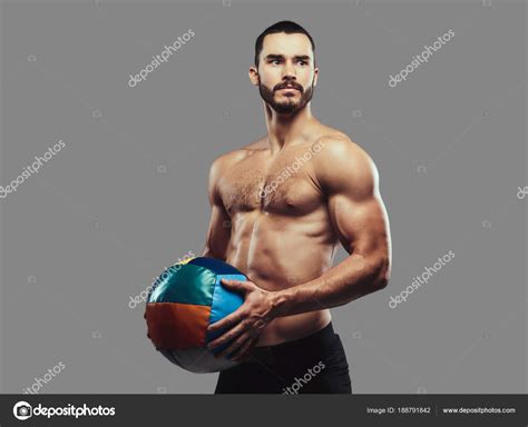 A Brutal Athletic Bearded Shirtless Male Posing With A Medball O Stock