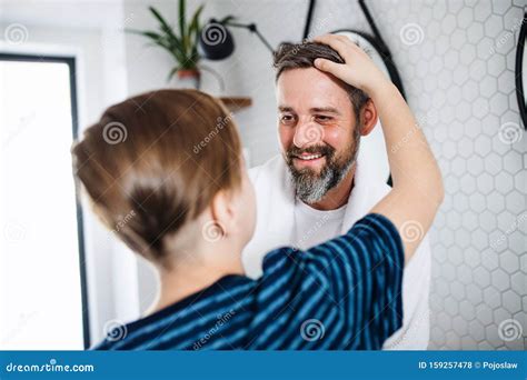Mature Father With Small In The Bathroom In The Morning Talking Stock Photo Image Of People
