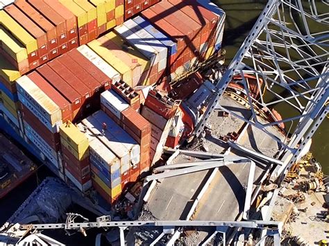 Salvage Crews Begin To Remove Containers From Ship That Crashed In