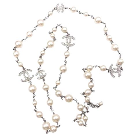 Chanel Classic Long Pearl Necklace With Cc Silver Crystal Logos At