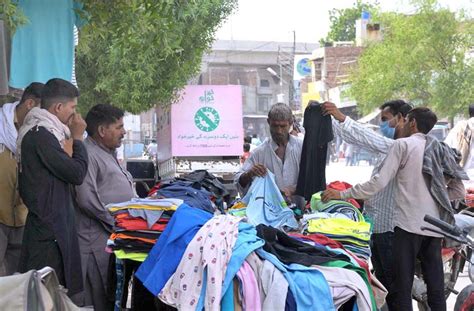 Multan August People Selecting And Purchasing Old Clothes