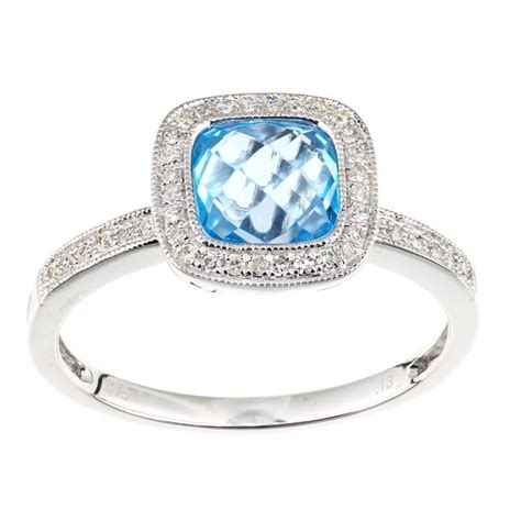 SPARKLD 9ct White Gold Cushion Blue Topaz And 0 13ct Diamond Halo Ring