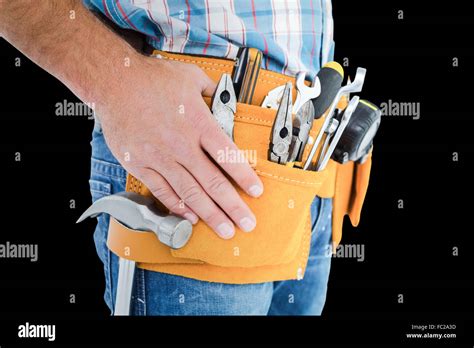 Composite Image Of Midsection Of Handyman Wearing Tool Belt Stock Photo