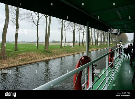 Boat cruise along canal in Bruges, Belgium Stock Photo - Alamy