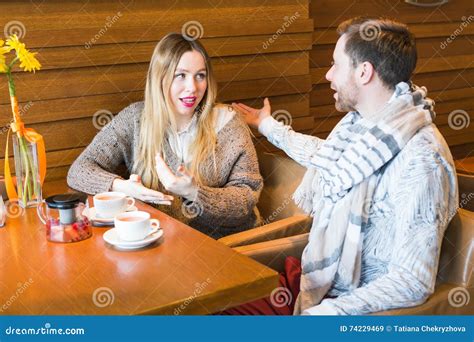 Young Couple Have Interesting Discussion In Cafe Stock Image Image Of