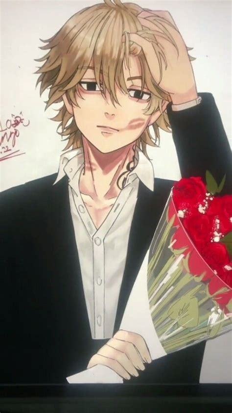 A Man Holding A Bouquet Of Flowers In Front Of His Face