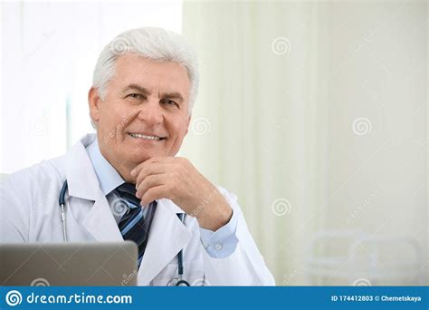 Portrait Of Senior Doctor In White Coat Stock Image Image Of