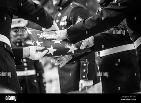 Us Marine Corps Body Bearers Conduct A Flag Folding Ceremony During