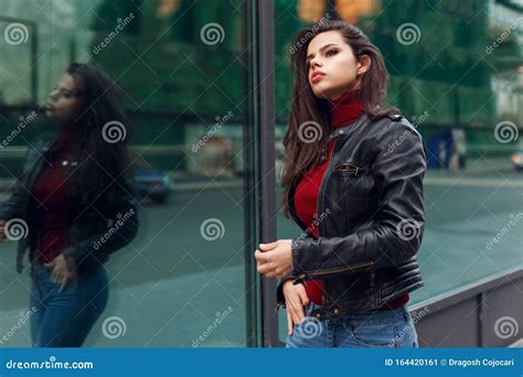 Beauty Portrait Of A Sensual Girl Walking In Street And Posing Outside