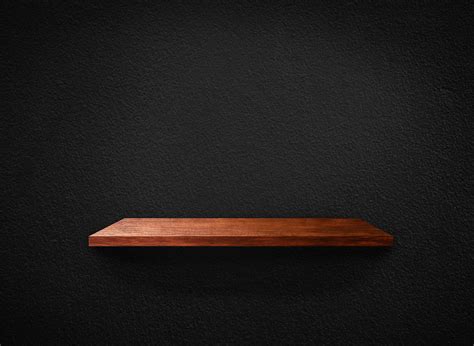 Light Wood Shelves On Black Wall Texture In Loft Style Background With