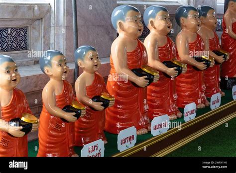 Line Of Buddhist Monk Statues At Wat Rakhang Temple Of Bells In