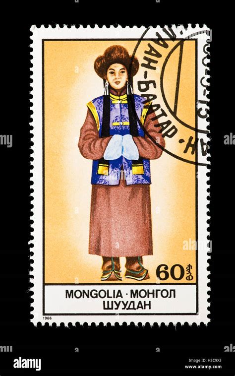 Postage Stamp From Mongolia Depicting A National Costume Stock Photo