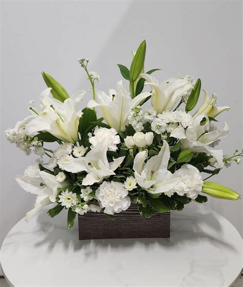 Peaceful White Lilies Basket By Teleflora In Mckinney Tx Big Buds