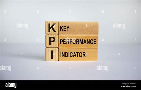 Concept Words Kpi Key Performance Indicator On Cubes On A Beautiful