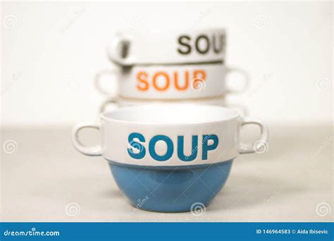 Ceramic Soup Bowls Stacked With Word Soup On Them Blue In Front Stock