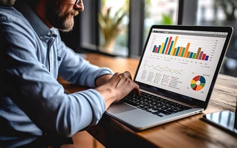 Premium Ai Image A Man Is Working On A Laptop At A Table With Data Graphs