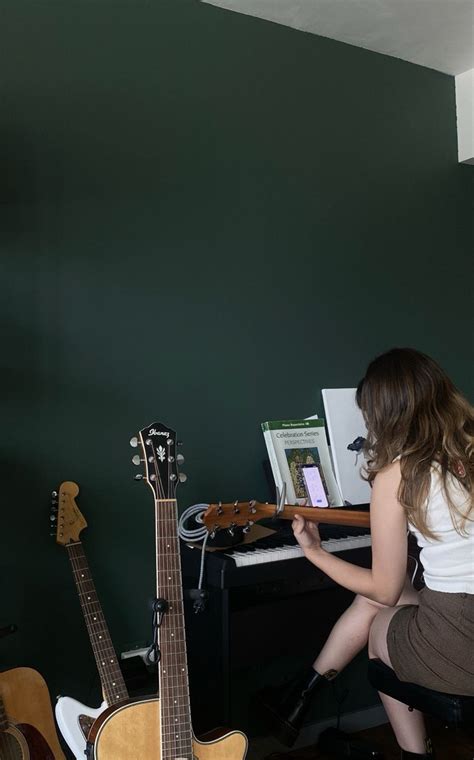 Talented Girl Creating Music With Guitar