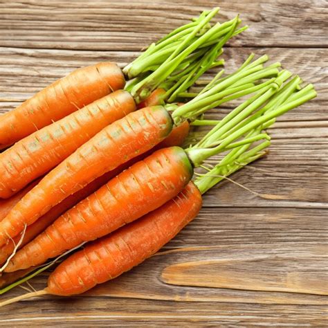 Premium Photo Carrots On Wooden Table