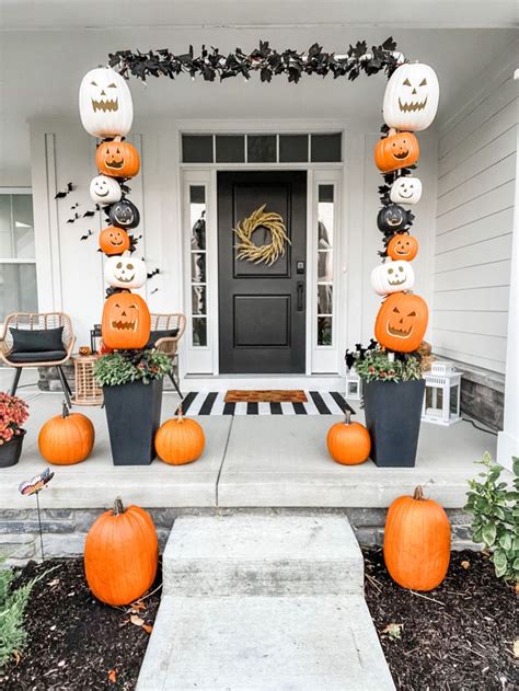 Halloween Decorations On The Front Porch With Pumpkins And Jack O Lanterns