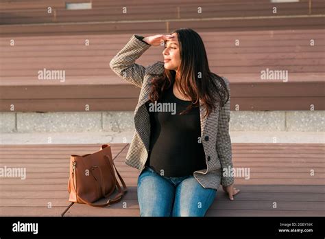 Urban Portrait Of A Modern Pregnant Latina Woman Pregnancy And