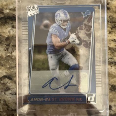 2021 Panini Clearly Donruss Rated Rookie Auto 84 Amon Ra St Brown