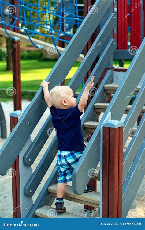 Little Boy Climbing Steps At The Playground Stock Photo Image Of