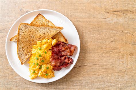 Scrambled Egg With Bread Toasted And Bacon Stock Photo At Vecteezy