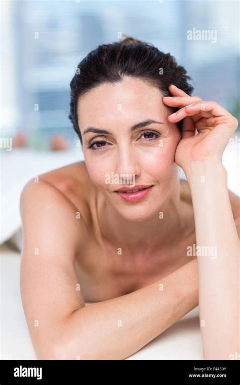 Smiling Brunette Relaxing On Massage Table Stock Photo Alamy