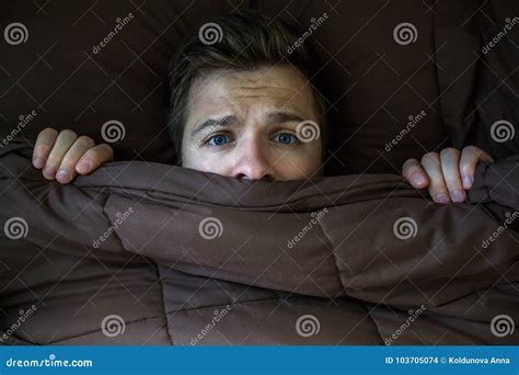 Caucasian Young Man Hiding in Bed Under the Blanket at Home. Stock ...