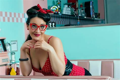 Premium Photo Pretty And Friendly Pin Up Girl In A 50s Restaurant Setting