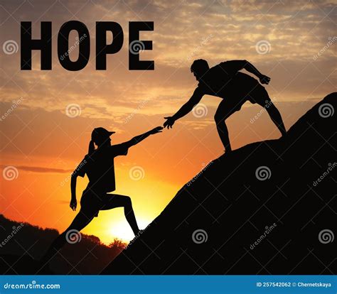Concept Of Hope Man Helping Woman To Climb On Hill At Sunset Stock
