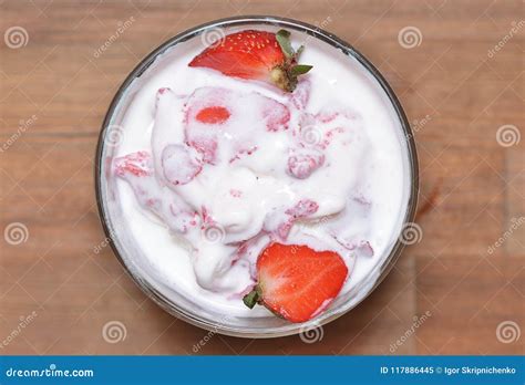 Melted Vanilla Ice Cream With Strawberry Slices Stock Image Image Of