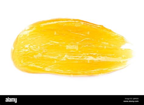 Transparent Yellow Gel Cream Smear Smudge Macro Isolated On White