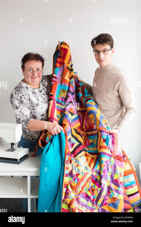 Quilting In The Workshop Of Tailors Male And Female Smiling Tailors