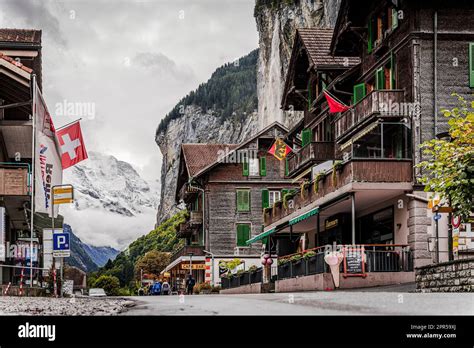 Traditional Wood Houses In The Alpine Village Of Lauterbrunnen With