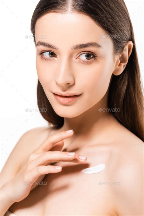 Beautiful Naked Woman With Perfect Skin Applying Cosmetic Cream On Skin