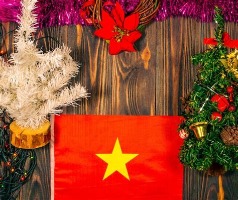 Premium Photo | Vietnam national flag on christmas wooden background with decorations.